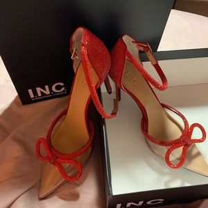 Selling Red blinged heels.